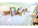 Open living room and dining area featuring tile flooring and natural light at 2246 E Yellowwood Ln, Martinsville, IN 46151