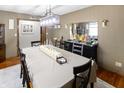 Formal dining room featuring a large table with seating for six and decorative lighting at 227 Vestal Rd, Plainfield, IN 46168