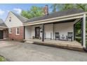 Inviting porch with black accents, rocking chairs, and ample space for relaxing and enjoying the outdoors at 253 W Westfield Blvd, Indianapolis, IN 46208