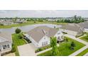 Stunning home with a lush front yard, pond view, and neighborhood amenities at 3821 Shady Lake Dr, Westfield, IN 46074