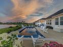 Gorgeous in-ground pool and outdoor dining with stunning sunset views at 3821 Shady Lake Dr, Westfield, IN 46074