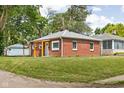 Charming brick house with green lawn in a quiet neighborhood at 4502 Evanston Ave, Indianapolis, IN 46205