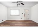 Bright, airy living room with modern flooring and a ceiling fan at 4502 Evanston Ave, Indianapolis, IN 46205