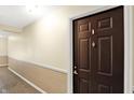 Hallway featuring a decorative wall trim with door on the right at 5011 Amber Creek Pl # 310, Indianapolis, IN 46237