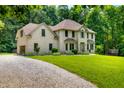 Charming two-story home with attached garage and a lush green lawn at 5055 Turkey Track Rd, Martinsville, IN 46151