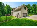 Back exterior view featuring a deck, fenced in yard and garage at 5055 Turkey Track Rd, Martinsville, IN 46151