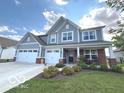 Charming two-story home with a two-car garage, covered porch, and manicured lawn at 520 Ferndale Ln, Danville, IN 46122