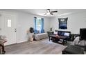 Bright living room features vinyl floors and ample natural light at 6949 Crittenden Ave, Indianapolis, IN 46220