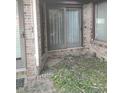 Enclosed patio space with brick surround and glass sliding doors to the interior of the house at 721 Maplewood Ave, Anderson, IN 46012