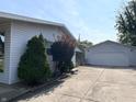 A detached garage with a clean concrete driveway and well-maintained exterior at 737 Howard St, Shelbyville, IN 46176