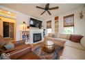Cozy living room with fireplace, built-in bookshelves, and comfortable seating arrangement at 7728 W 200 S, New Palestine, IN 46163