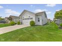 A lovely single-story home with lush green lawn and a two-car garage at 820 Elise Dr, Westfield, IN 46074
