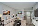 Inviting living room with neutral tones, modern decor, plush rug, and ample natural light at 10420 Day Star Dr, Indianapolis, IN 46234