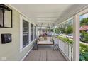 Inviting front porch with a comfortable porch swing, creating a relaxing outdoor space at 1623 Hoyt Ave, Indianapolis, IN 46203