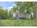 Charming two-story home with landscaped yard and a beautiful porch, perfect for relaxing outdoors at 17320 Joliet Rd, Westfield, IN 46074