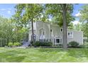 Charming two-story home with landscaped yard and a beautiful porch, perfect for relaxing outdoors at 17320 Joliet Rd, Westfield, IN 46074