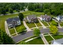 Aerial view of homes in a neighborhood featuring mature trees and grassy lawns at 17877 Kinder Oak Dr, Noblesville, IN 46062