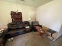 Cozy living room with leather sofa and wooden table at 1809 E 13Th St, Muncie, IN 47302