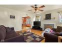 Cozy living room with hardwood floors, a decorative fireplace, and comfortable seating at 1944 Union St, Columbus, IN 47201