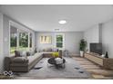 Spacious living room featuring large windows, stylish furniture, and contemporary decor at 1993 Mulberry St, Noblesville, IN 46060