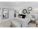 Bright bedroom with a comfortable bed, stylish decor, and sliding door to closet at 2717 Reflection Way, Greenwood, IN 46143