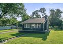 Charming home featuring a well-maintained lawn, and classic architectural details at 2719 Denison St, Indianapolis, IN 46241