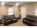 Comfortable living room features recliner seating and neutral wall color at 2954 N Drexel Ave, Indianapolis, IN 46218