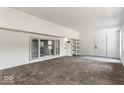 Enclosed patio with brick flooring, white walls, and a side door leading to additional space at 3529 Hunt St, Plainfield, IN 46168