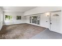 Enclosed patio featuring brick flooring, white walls, and windows providing natural light at 3529 Hunt St, Plainfield, IN 46168