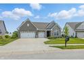 Charming single Gathering home features a three-car garage and professionally maintained lawn at 3839 Albert Ln, Bargersville, IN 46106