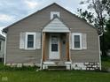 Charming single Gathering home featuring a gable roof, siding, and a small front porch at 4715 Normal Ave, Indianapolis, IN 46226