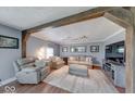 Comfortable living room featuring neutral tones, wood beam accents, and cozy seating at 608 W 600 N, Fortville, IN 46040