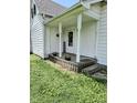 Charming front porch with decorative flower pots, 'Welcome' sign, and a quaint, inviting entrance at 627 Plum St, Noblesville, IN 46060