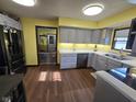 Modern kitchen with stainless steel appliances and light gray cabinetry at 627 Plum St, Noblesville, IN 46060