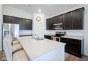 Well-equipped kitchen boasts sleek cabinets, stainless steel appliances, and a spacious island at 6608 W Shoreline Ct, Greenfield, IN 46140
