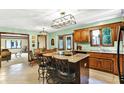 Spacious kitchen with a center island, granite countertops, and ample cabinet space at 664 N Scott Dr, Greenwood, IN 46142