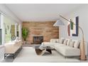 Inviting living room with stone fireplace and comfortable seating, perfect for relaxing and entertaining at 91 N Raceway Rd, Indianapolis, IN 46234