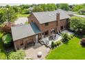 An aerial shot of a backyard that offers a brick patio with seating at 11354 Royal Pl, Carmel, IN 46032