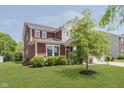 Well-manicured two-story home featuring beautiful landscaping, and attractive exterior details at 11840 Crossbill Ct, Noblesville, IN 46060
