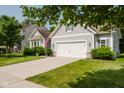 Charming home featuring a well-manicured lawn, two-car garage, and inviting curb appeal at 18973 Elder Ridge Dr, Noblesville, IN 46062
