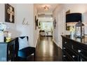 Hallway featuring gleaming hardwood floors and stylish decor at 18973 Elder Ridge Dr, Noblesville, IN 46062
