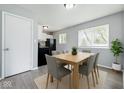 Cozy dining area with modern table, seating, and natural light, adjacent to the kitchen at 1931 Brentwood Dr, Anderson, IN 46011