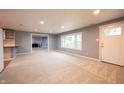 Comfortable living room with fresh carpet, an open floor plan and access to the kitchen at 196 Park Ave, Bargersville, IN 46106
