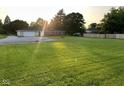 Expansive backyard featuring a well-maintained lawn and detached garage at 2951 S Elizabeth St, Indianapolis, IN 46203