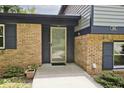 Close up view of a brick home with a glass front door at 3545 Whippoorwill Lake N Dr, Monrovia, IN 46157