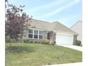 Well maintained home with a manicured lawn and mature landscaping at 4420 Wild Turkey Dr, Indianapolis, IN 46239