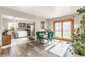 Open concept dining area with modern table, chairs, and sliding doors to outside area at 48 Wilson Dr, Carmel, IN 46032