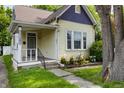 Charming single-Gathering home featuring a cozy front porch, well-maintained yard, and a blend of classic architectural details at 602 Prospect St, Indianapolis, IN 46203