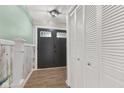 Inviting entryway with wood floors, closet space, and stylish front door at 750 Hillcrest Dr, Greenwood, IN 46142