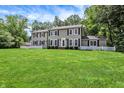 Charming two-story home with black shutters and a lush green lawn at 9650 Copley Dr, Carmel, IN 46290